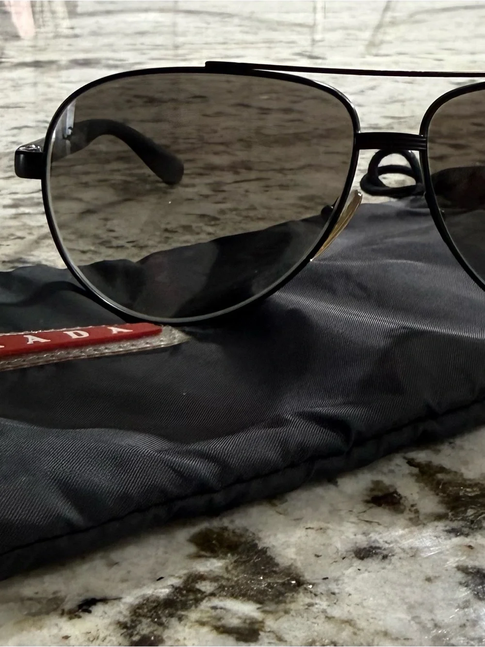 Prada Black Frame Sunglasses with Dark Lenses